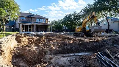 excavation a house foundation during site preparation in texas soil